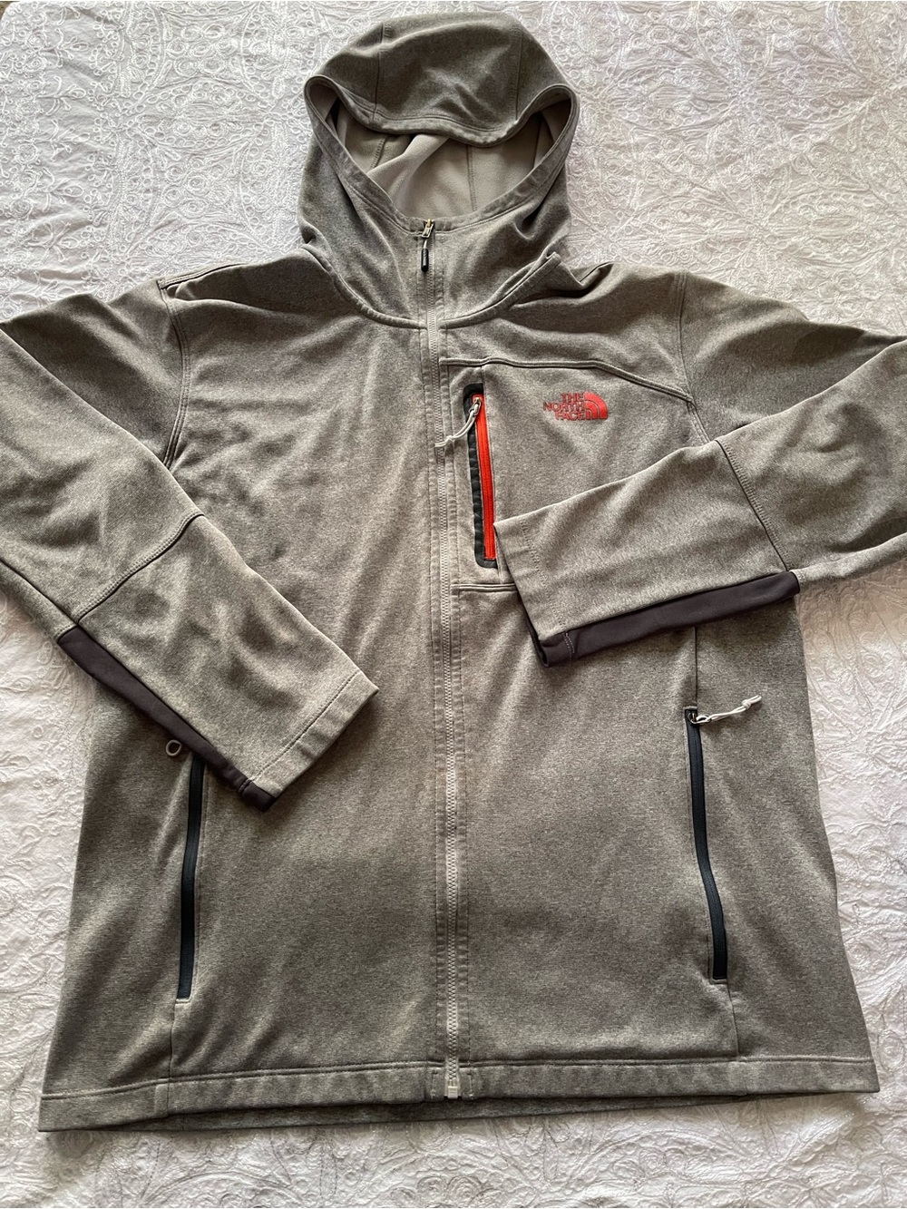 The North Face Men's Hooded Lightweight Jacket in Light Gray with Orange Accents